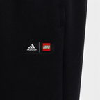 Trade Sports black Adidas x LEGO VIDIYO track pants featuring a collaborative logo patch on the leg