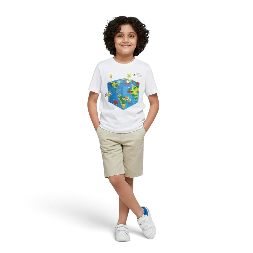 Child wearing a white t-shirt with a colorful graphic design on a plain background Main image