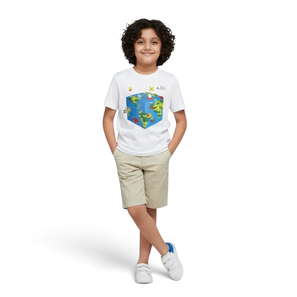 Child wearing a white t-shirt with a colorful graphic design on a plain background Main image
