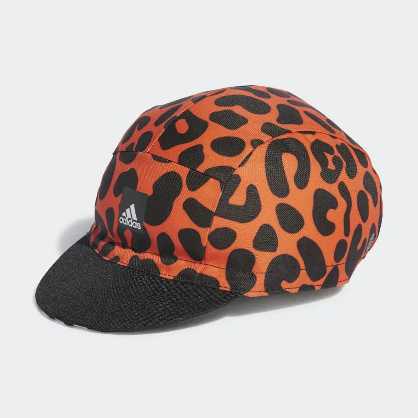 Side Profile Image: Capturing the sleek five-panel silhouette and the vibrant leopard graphic electrification against the Semi Solar Orange base.