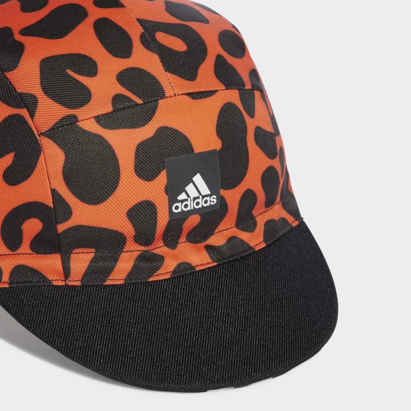 Highlighting the straight brim and animal print crowns, showcasing the high-detail twill texture for a "locked-in" archival look.
