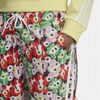 Trade Sports Adidas x Marimekko track pants featuring a vibrant Unikko poppy floral print and iconic 3-Stripes detail.