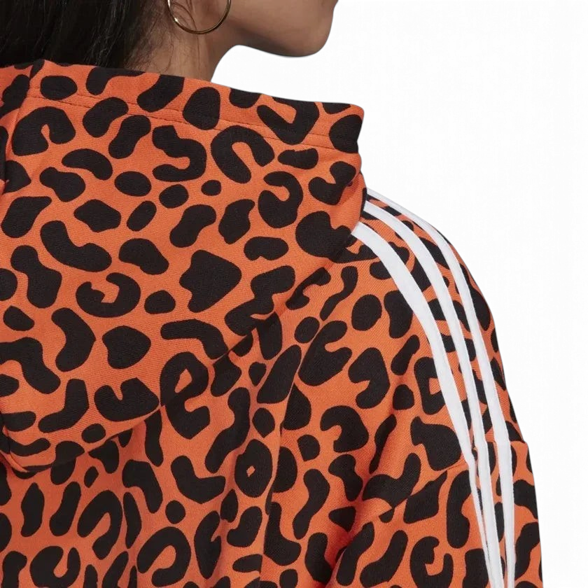 Detailed zoom on the hood and drawcord of the Adidas x Rich Mnisi Hoodie, highlighting the adjustable fit and the all-over graphic print.