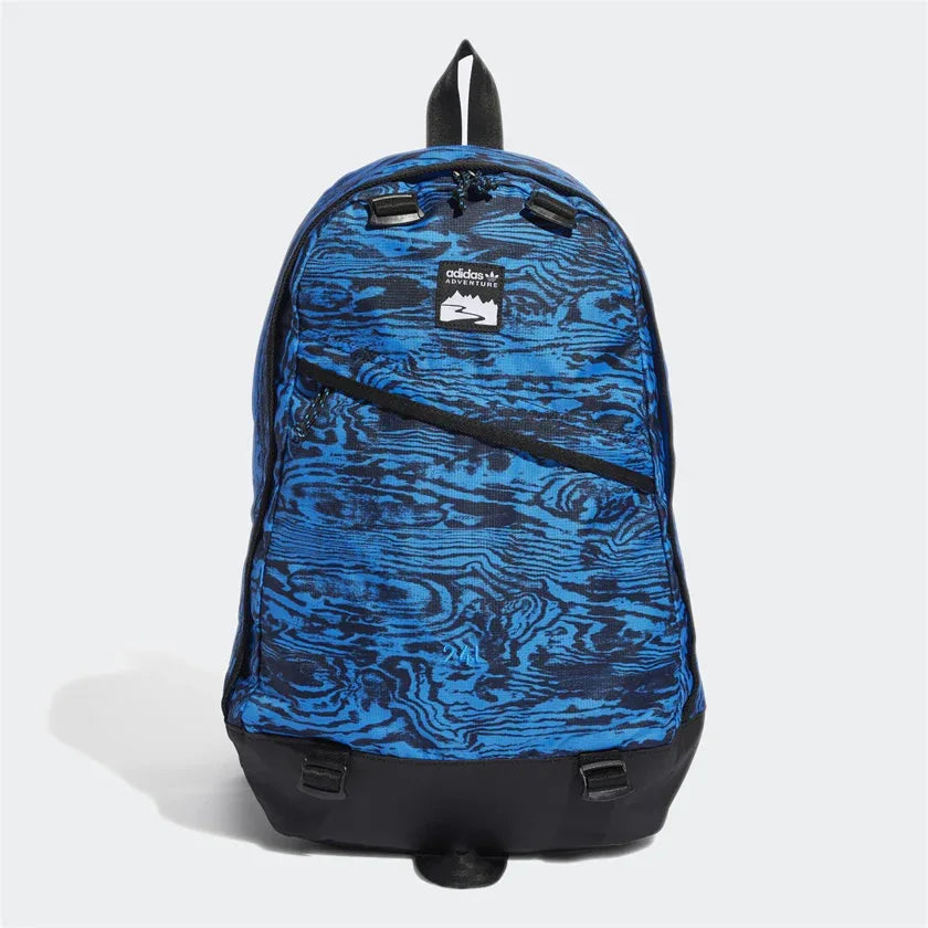 Adidas Adventure Backpack in blue and black, front view showing top zip closure, front zip pocket, and woven loops for attachments. Main image