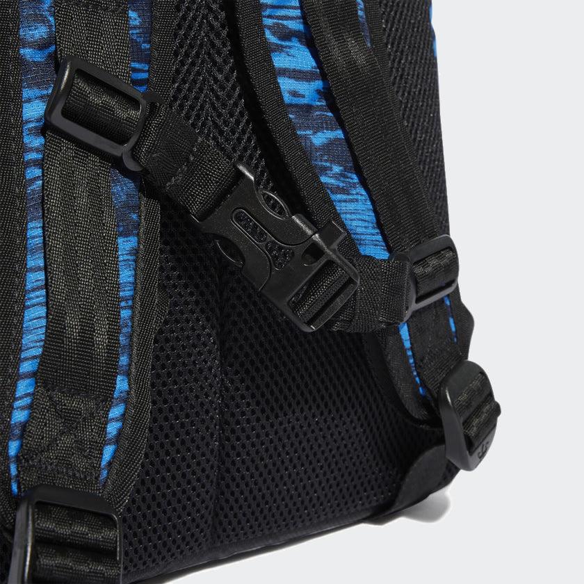 Close-up zoom on the fabric of the Adidas Adventure Backpack, showing the ripstop texture and subtle blue/black pattern detail.