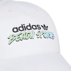 Close-up zoom on the fabric of the Adidas Originals Graphic Retro Baseball Cap, showing the soft cotton texture and the detailed embroidered logo.