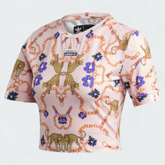 Adidas x Her Studio London Cropped Tee in a multi-color floral print, front view showing the ribbed crewneck, loose fit, and Adidas Trefoil logo.