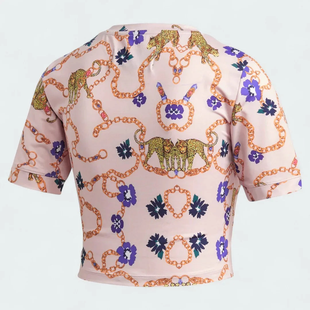 Adidas x Her Studio London Cropped Tee in a multi-color floral print, back view showcasing the continuation of the vibrant all-over graphic.