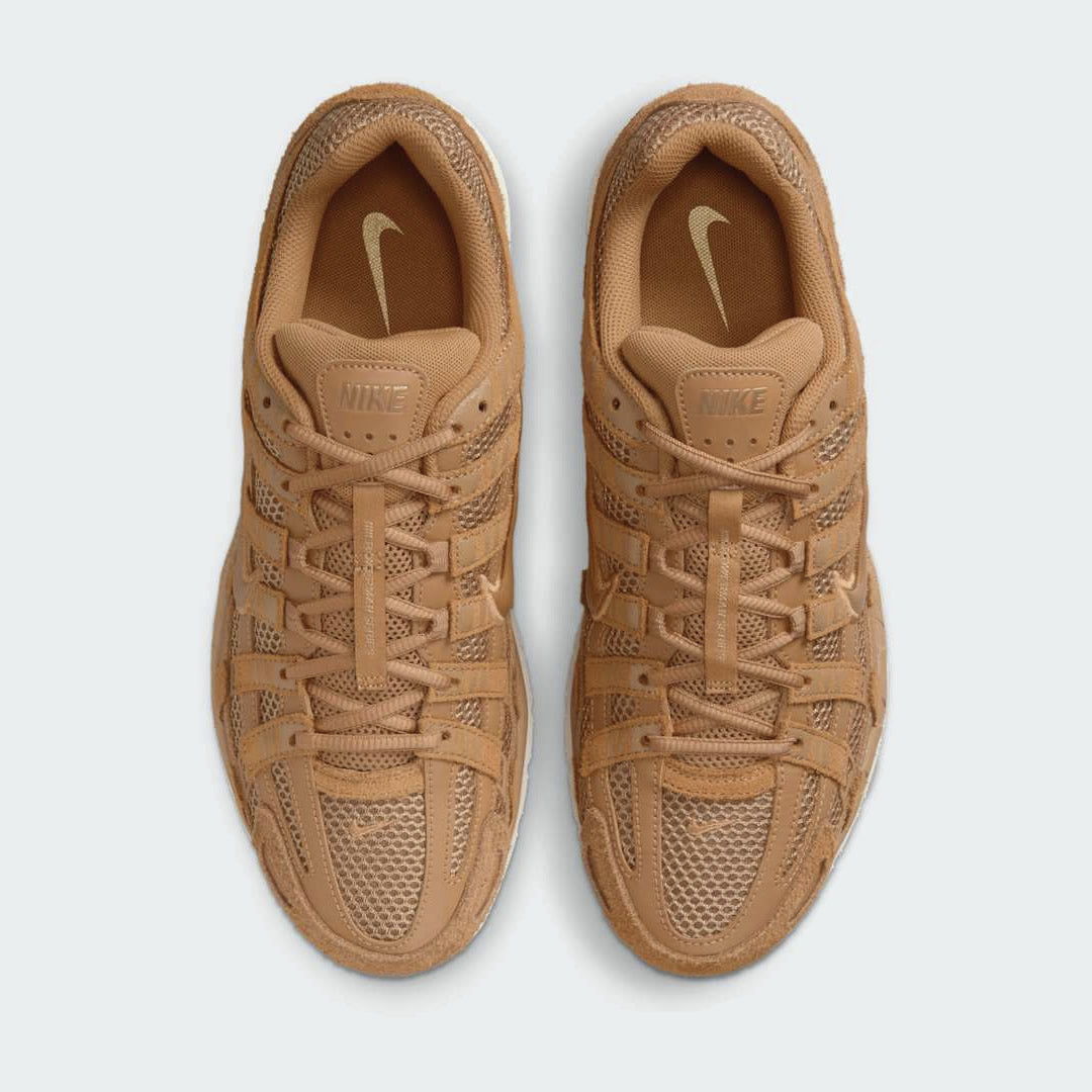 Top-down view of a pair of Nike P-6000 SE men's trainers in flax, highlighting the intricate layered upper and lace-up closure.
