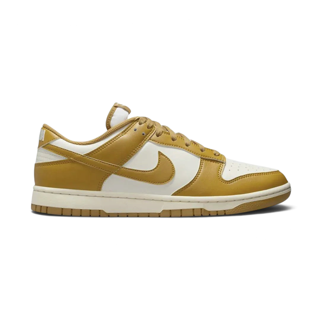 Nike Dunk Low Retro Men's trainers in wheat brown, side profile showing classic leather upper, black Swoosh, and white midsole. Main image