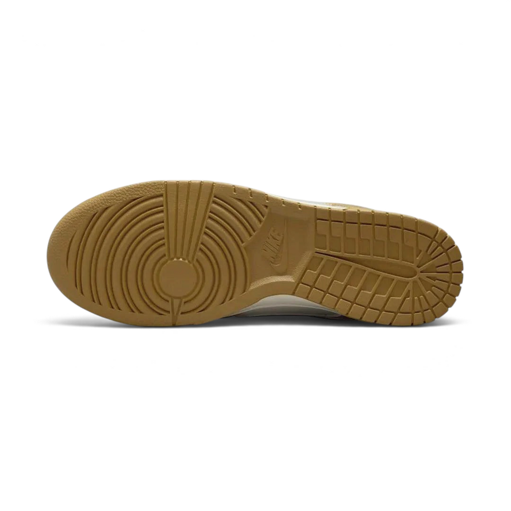 View of the outsole of the Nike Dunk Low Retro Men's wheat trainers, showing the durable rubber sole and pivot circles for traction.