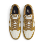 Top-down view of a pair of Nike Dunk Low Retro Men's trainers in wheat, highlighting their iconic silhouette and lace-up closure.