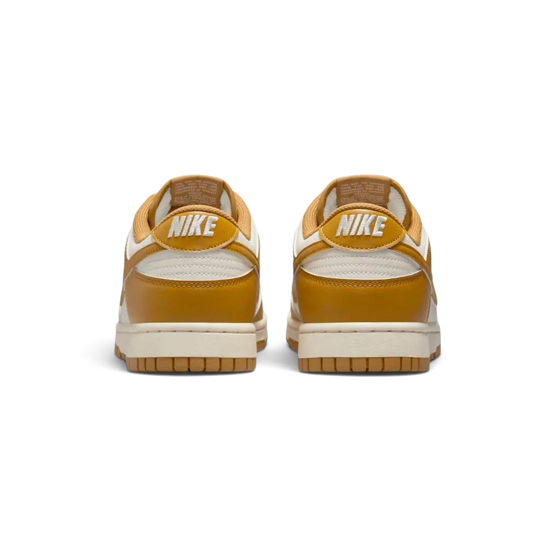 Rear view of the Nike Dunk Low Retro Men's wheat trainers, focusing on the contrasting black heel tab with white Nike branding.