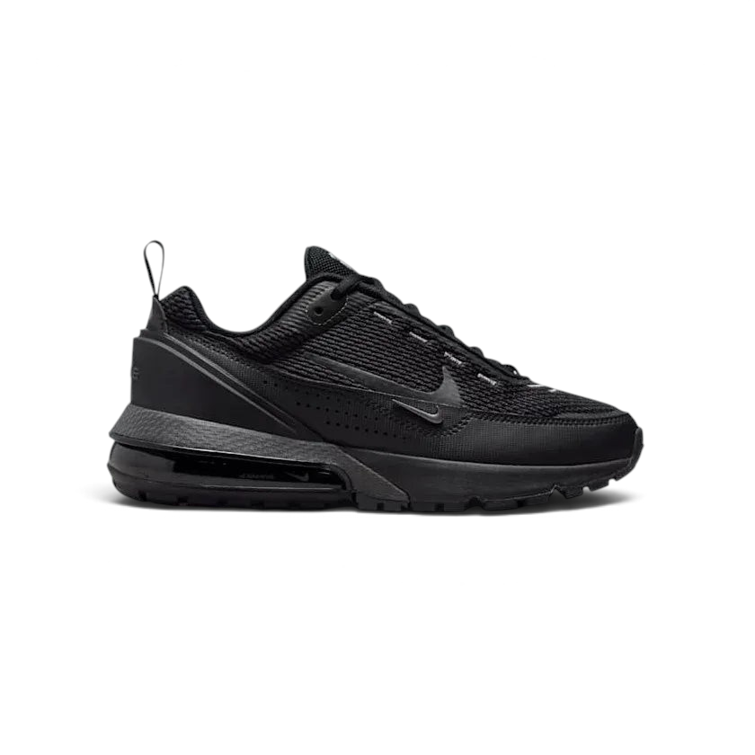 Nike Air Max Pulse Juniors' trainers in black and grey, side profile showing visible point-loaded Max Air unit and layered textile upper.