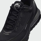 Close-up zoom on the front of the Nike Air Max Pulse Juniors' trainers, showing the mesh toe box, lacing system, and synthetic overlays.