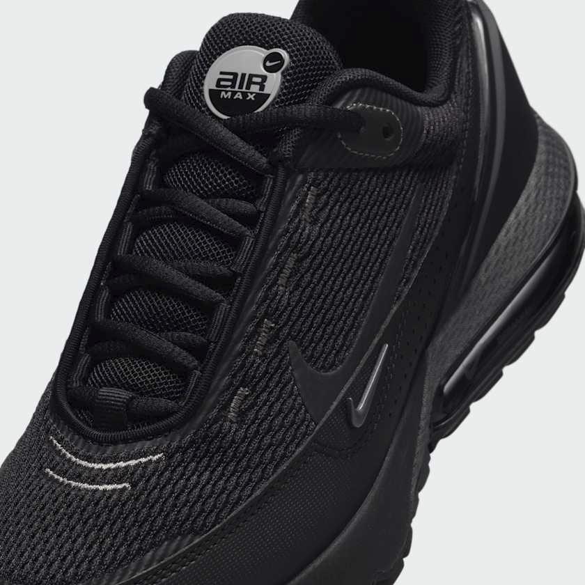 Close-up zoom on the front of the Nike Air Max Pulse Juniors' trainers, showing the mesh toe box, lacing system, and synthetic overlays.
