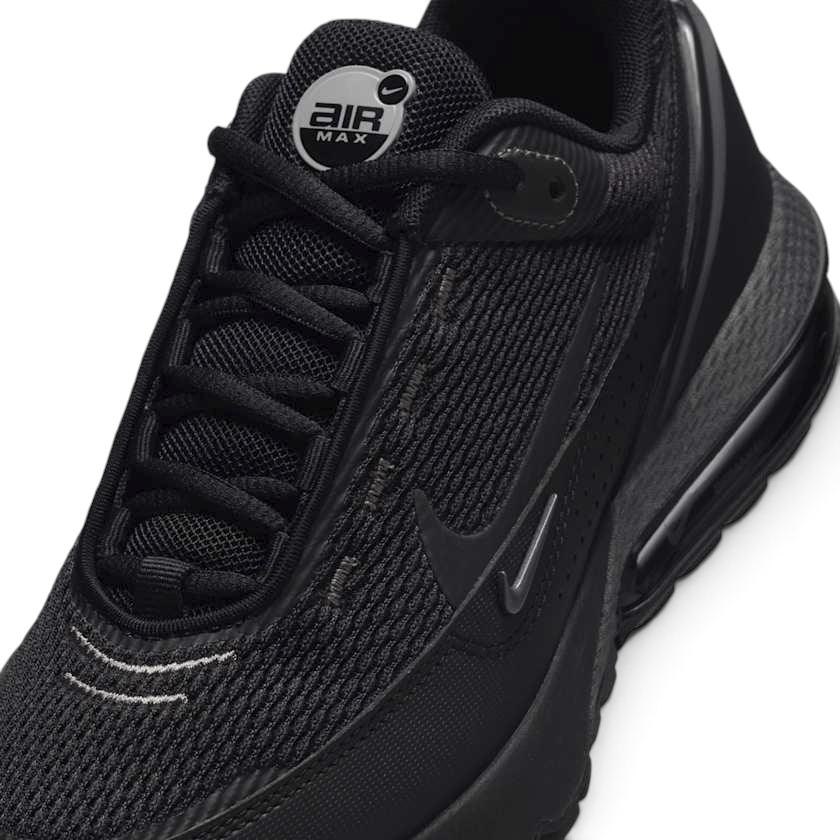 Close-up zoom on the front of the Nike Air Max Pulse Juniors' trainers, showing the mesh toe box, lacing system, and synthetic overlays.
