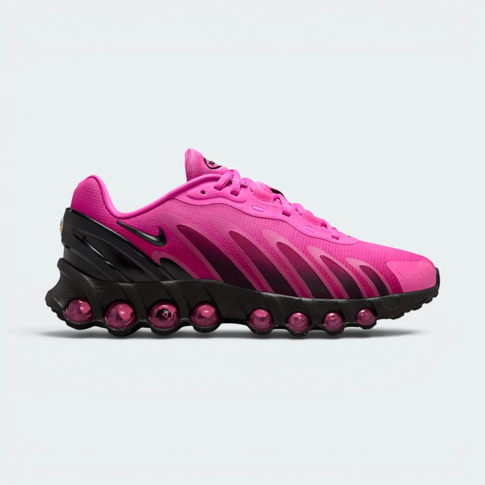 Highlights the high-velocity sweep of the fuchsia mesh, showing the professional integration of the eight translucent pink air tubes nestled cleanly within the sleek black midsole housing. Main image