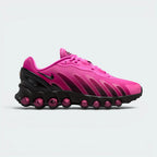 Highlights the high-velocity sweep of the fuchsia mesh, showing the professional integration of the eight translucent pink air tubes nestled cleanly within the sleek black midsole housing.