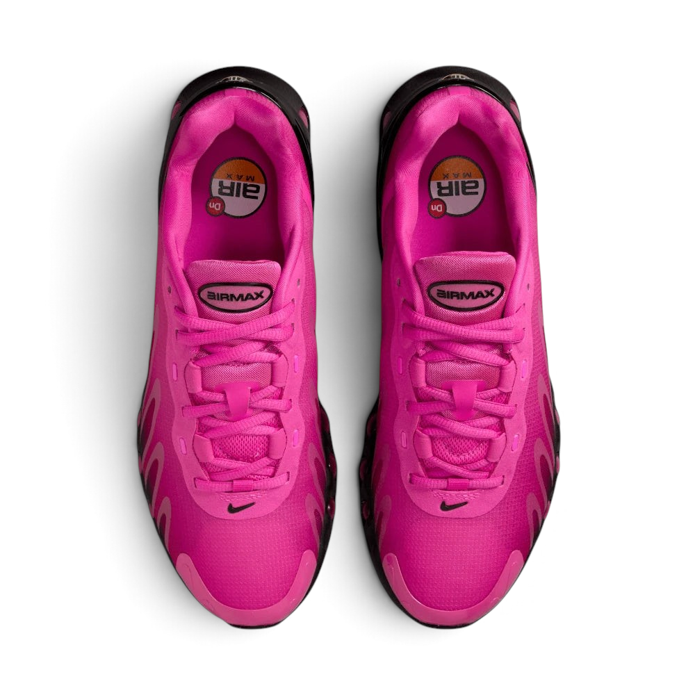 Focuses on the locked-in lacing layout, displaying the perfect symmetry of the technical fuchsia tongue and the seamless reinforcement skins guarding the front toe box.