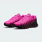 Emphasising the low-slung, futuristic athletic silhouette and the professional distribution of the high-contrast pink branding markers.
