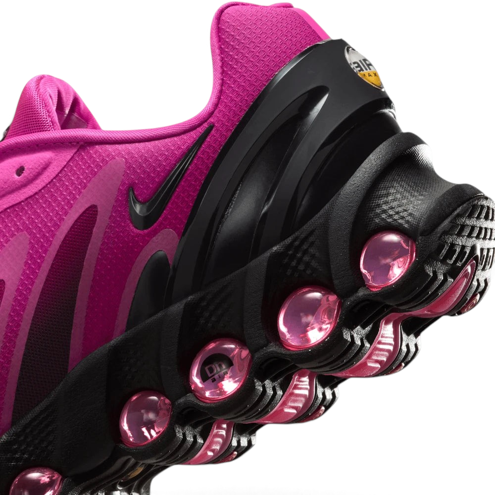 Highlights the "unreal" clean finish where the upper fuchsia textile mudguard seamlessly bonds onto the top rim of the multi-pod air capsule.