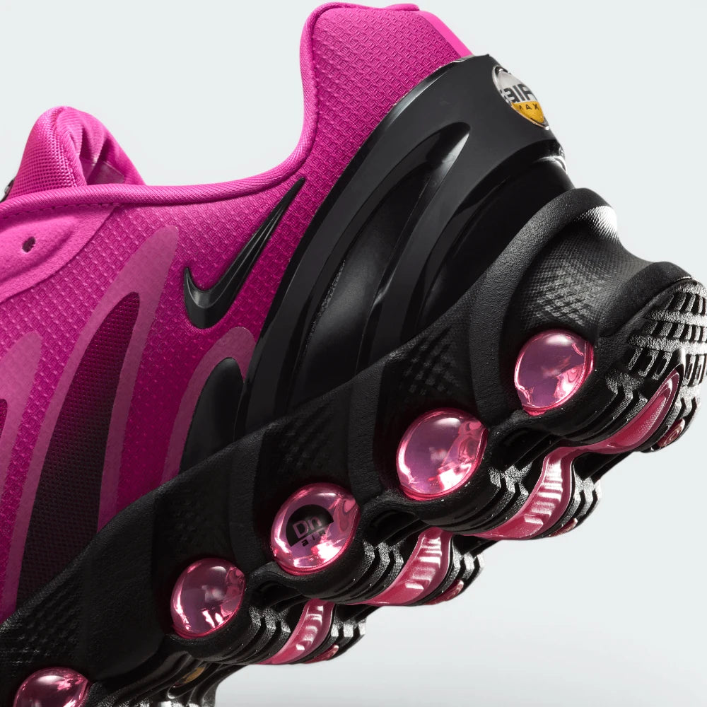 Highlights the "unreal" clean finish where the upper fuchsia textile mudguard seamlessly bonds onto the top rim of the multi-pod air capsule.