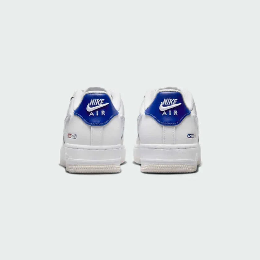 Rear view of the Nike Air Force 1 LV8 Juniors' white trainers, focusing on the heel panel and Nike Air branding.