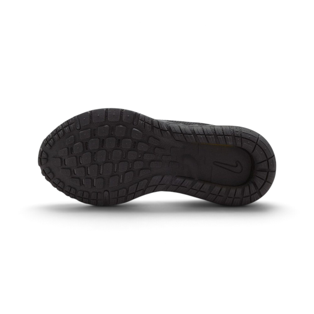 Displays the full-length black rubber sole, showcasing the multi-directional lug grid pattern engineered for unreal grip on outdoor play surfaces and indoor court floors.