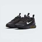 Emphasising the athletic, forward-leaning stance of the trainers and the sharp contrast between the black upper and the popping Sonic Yellow Air unit windows.