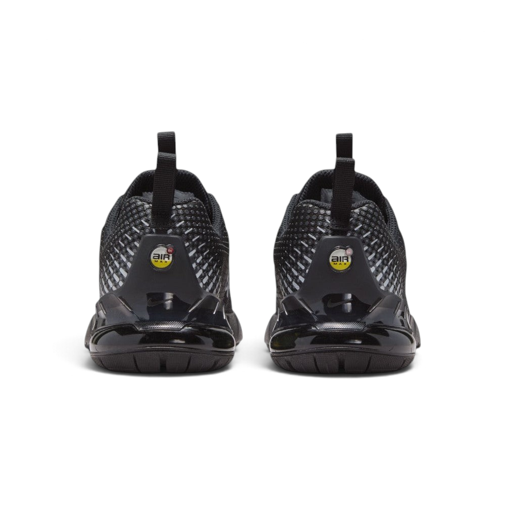 Focuses on the rear profile, highlighting the dual black pull tabs, circular yellow-and-black "AIR MAX" badges, and the translucent black heel clip framing the yellow Air bubble.
