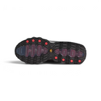 View of the rubber outsole of the Air Max DN8, showcasing the multi-surface traction pattern and the visible red Air chambers.