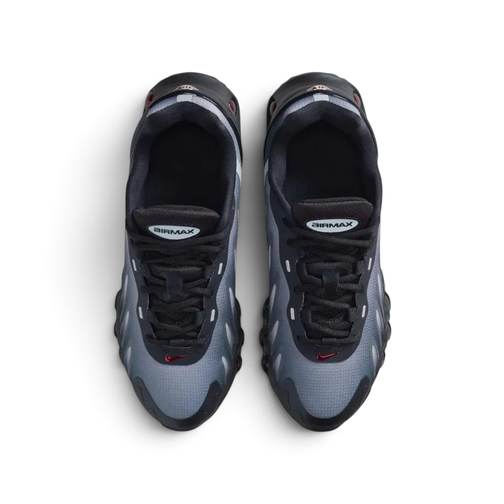 Top-down view of the black and red Air Max DN8 trainers, highlighting the haptic mesh texture and the Gym Red DN logo on the tongue.