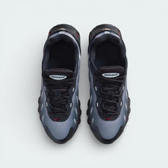 Top-down view of the black and red Air Max DN8 trainers, highlighting the haptic mesh texture and the Gym Red DN logo on the tongue.