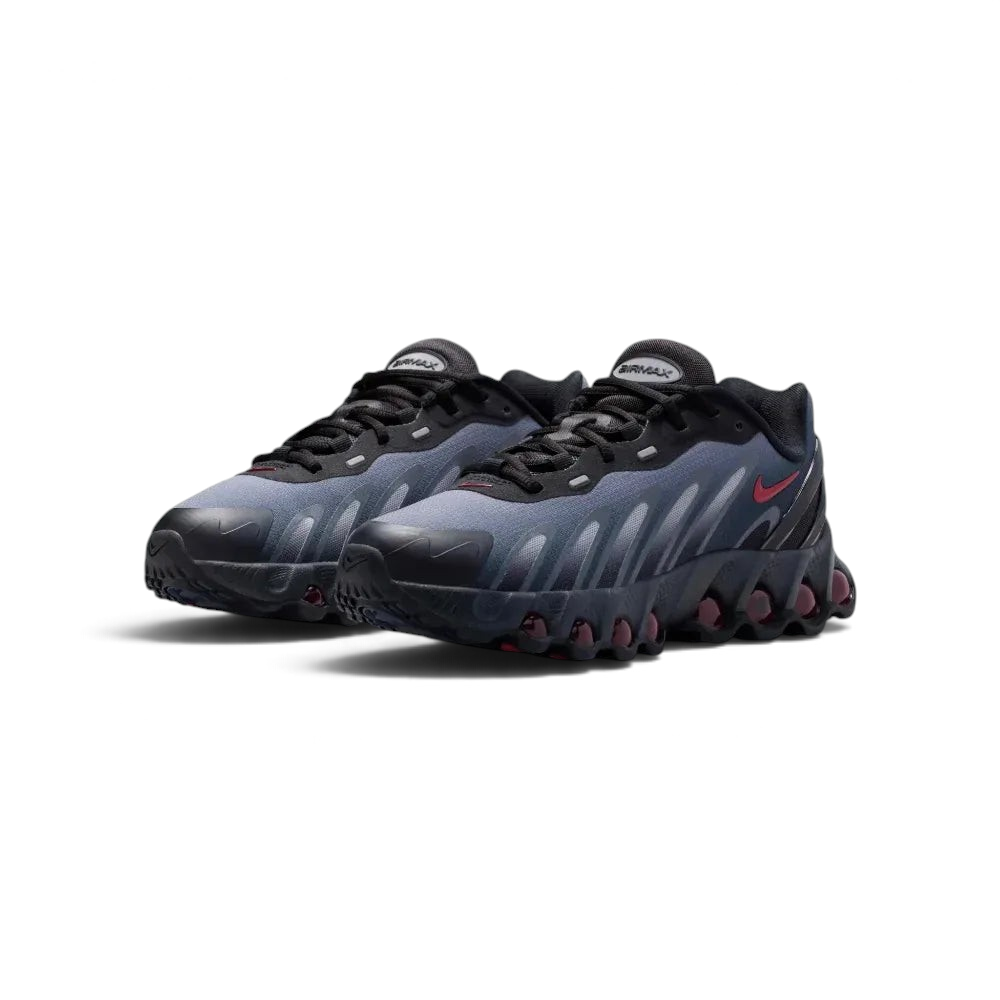 Angled shot of both Nike DN8 trainers side by side, showcasing the aerodynamic shape and the bold contrast between the black mesh and red accents.
