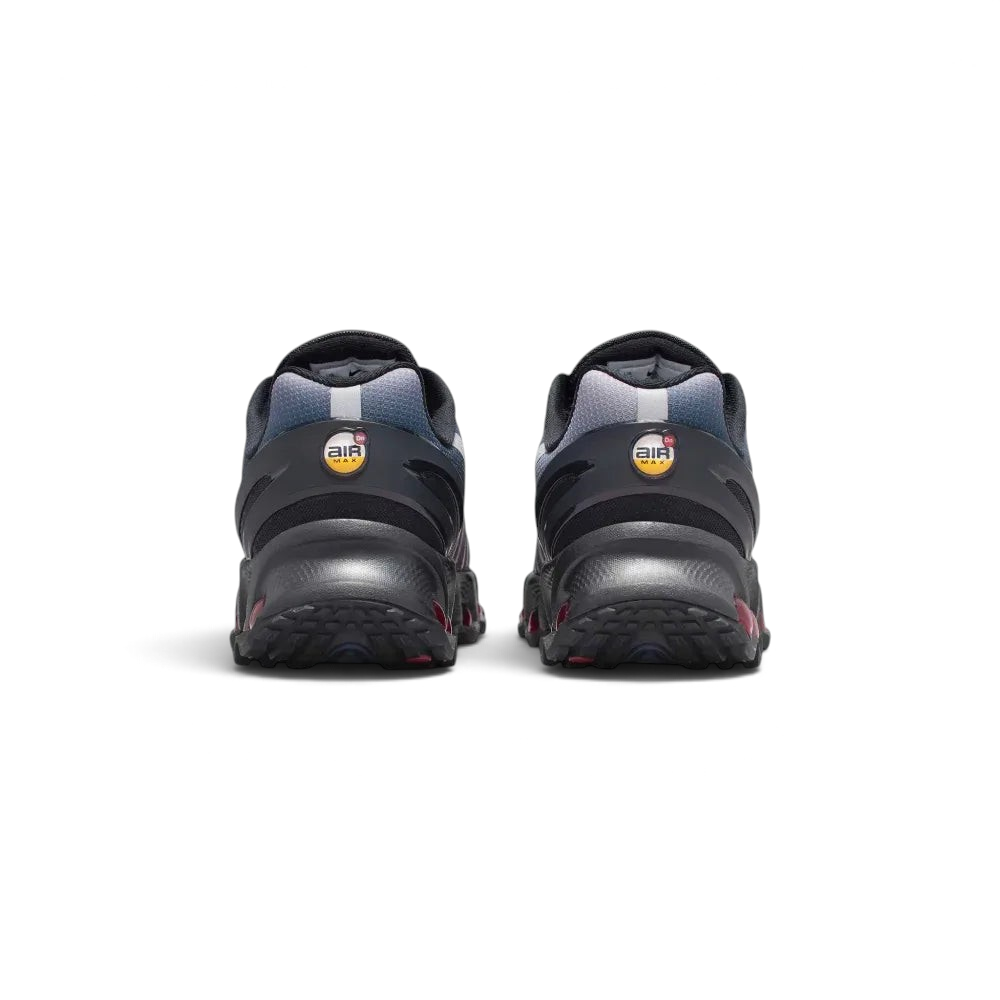 Rear view focusing on the stacked multi-chamber Air units in Gym Red and the structured heel clip featuring the circular DN emblem.