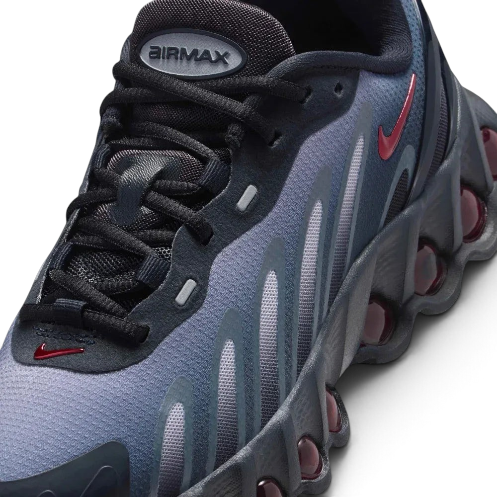 Close-up of the front, showing the detailed haptic mesh upper and the secure black lacing system for a locked-in fit.