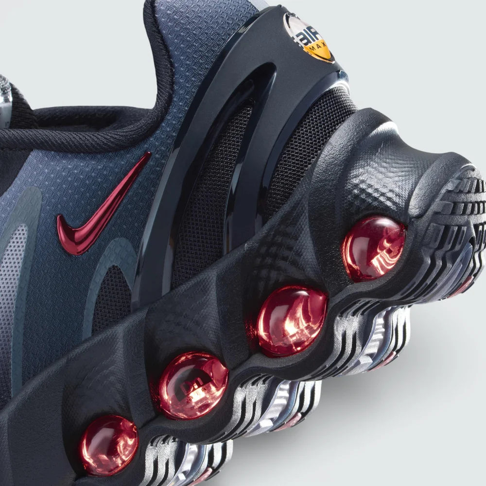 Close-up of the front, showing the detailed haptic mesh upper and the secure black lacing system for a locked-in fit.