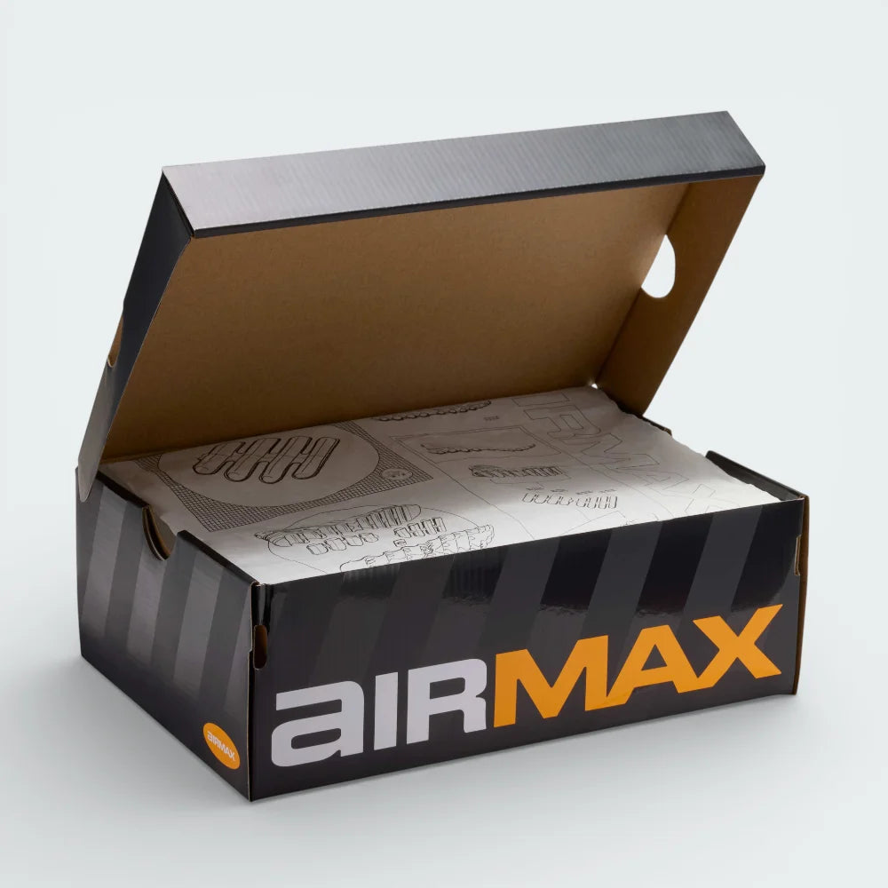 Open shoe box with 'Air Max' branding on a light gray background
