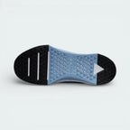 View of the rubber outsole, showcasing the deep flex grooves in the forefoot and the flat, stable rubber traction in the heel.
