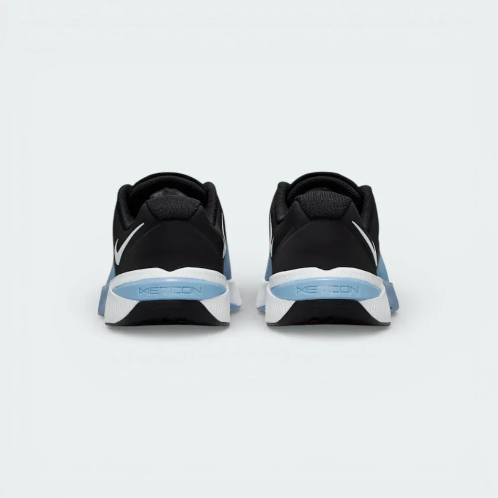 Rear view focusing on the wide, stable Metcon heel structure and the Blue Hero heel pull tab.