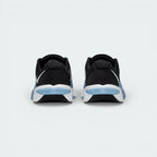 Rear view focusing on the wide, stable Metcon heel structure and the Blue Hero heel pull tab.