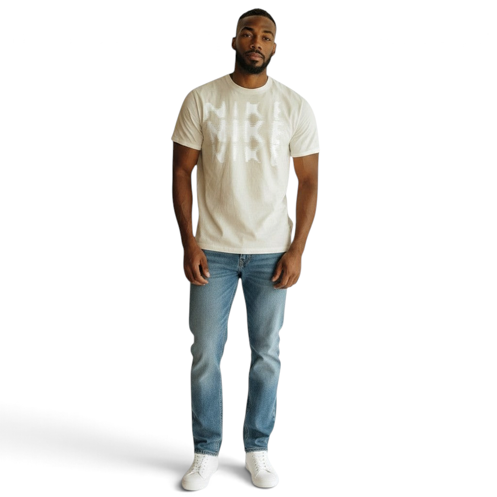 Man wearing a beige t-shirt and blue jeans on a white background Main image