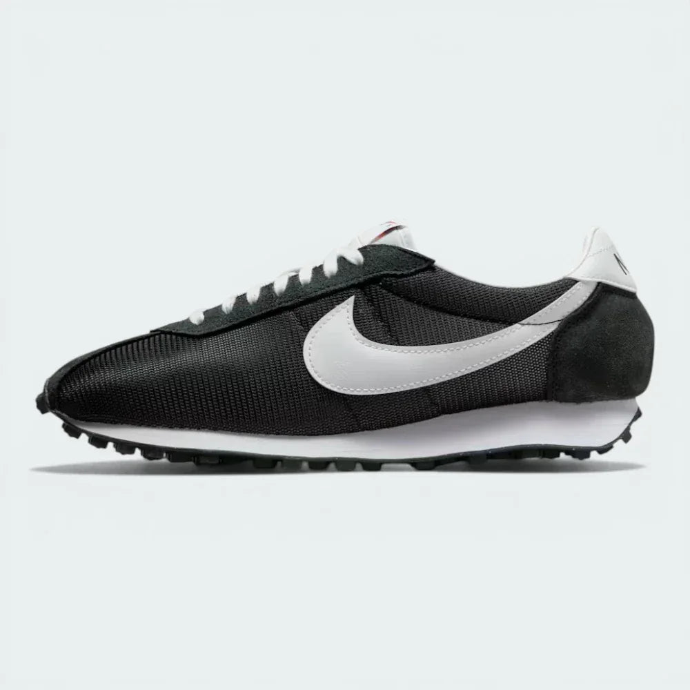 Outer Side profile of the Black/White Nike LD-1000, showcasing the iconic flared heel and the contrast white Swoosh on a mesh upper.