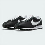 Three-quarter view of the pair, emphasizing the vintage 70s aesthetic and the suede-to-mesh transitions.