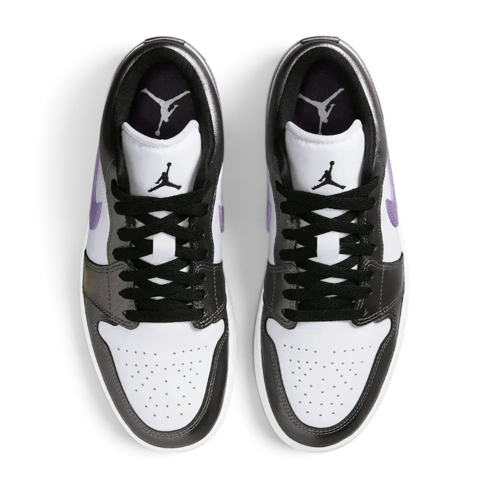 Top-down view of the trainers, highlighting the perforated toe box and the crisp white lacing system against the premium leather tongue.