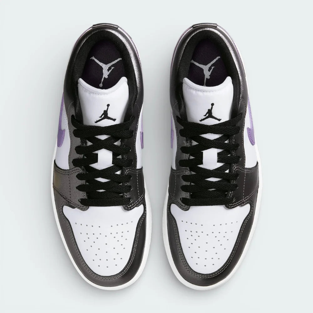 Top-down view of the trainers, highlighting the perforated toe box and the crisp white lacing system against the premium leather tongue.