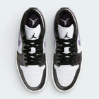 Top-down view of the trainers, highlighting the perforated toe box and the crisp white lacing system against the premium leather tongue.