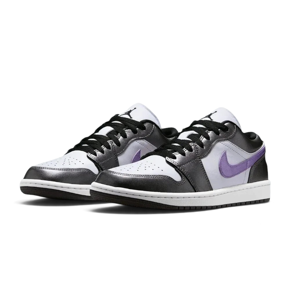 Angled shot of both Air Jordan 1 Low SE trainers, showcasing the luxurious material mix and the sleek, low-profile silhouette.