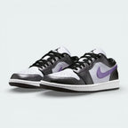 Angled shot of both Air Jordan 1 Low SE trainers, showcasing the luxurious material mix and the sleek, low-profile silhouette.